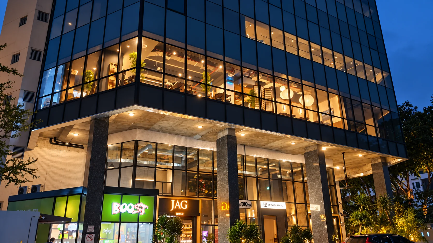 Wisma JAG building exterior in Taman Desa at dusk